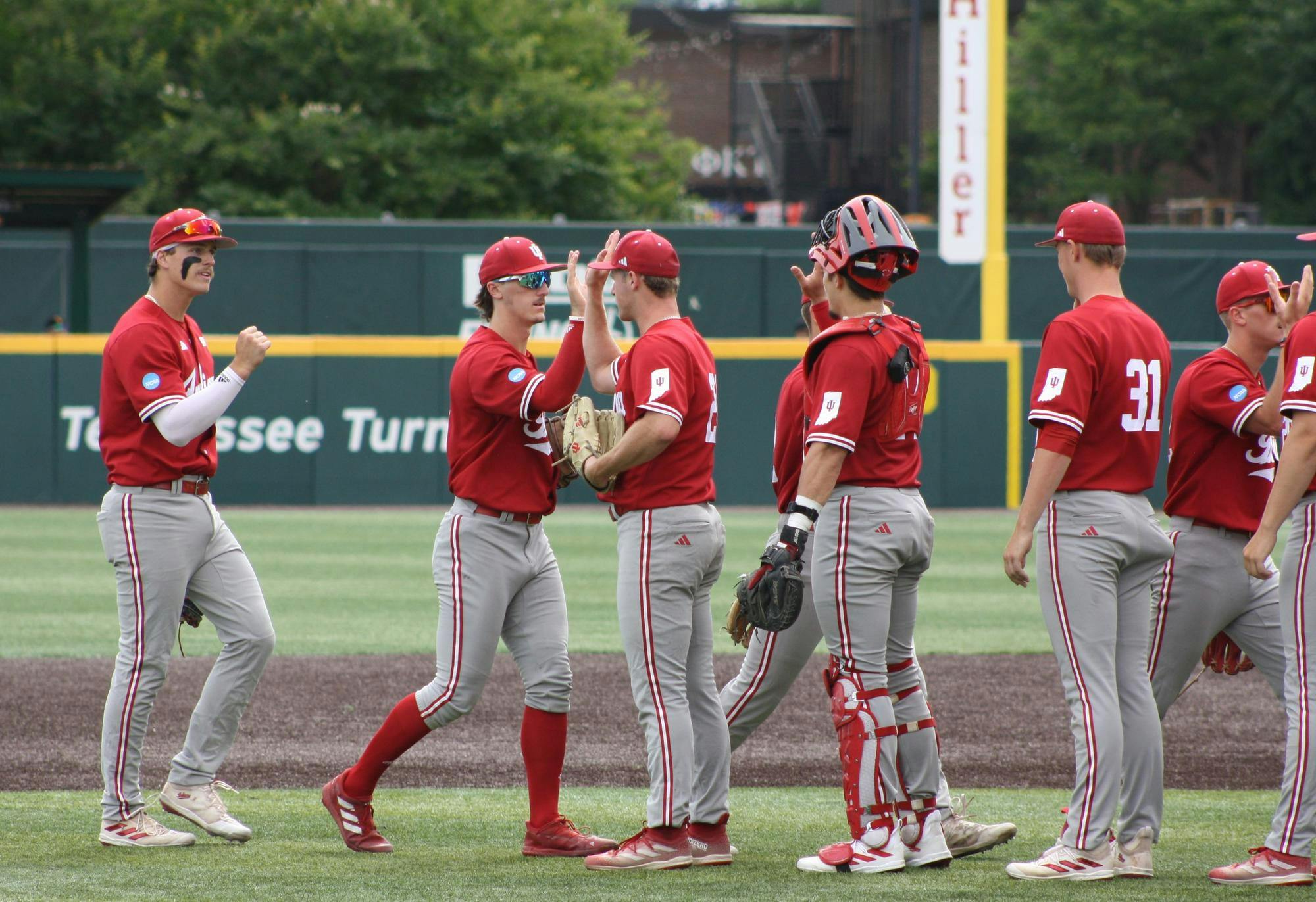 Indiana players celebrate after winning their first game of the Knoxville Regional on May 31. The Hoosiers will face either No. 1 Tennessee or No. 4 Northern Kentucky at 6 p.m. Saturday.