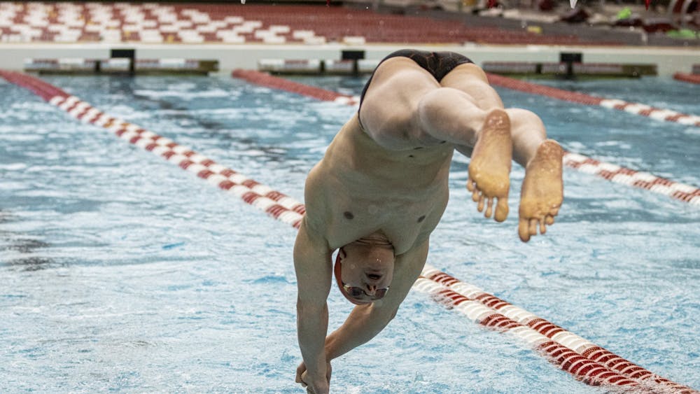 Freshman Rafael Miroslaw dives into the pool during the men&#x27;s 400-yard freestyle relay against Purdue on Jan. 22, 2022, at the Counsilman Billingsley Aquatic Center. Miroslaw finishes the race in the lead to give Indiana the win in the men&#x27;s 400-yard freestyle relay Saturday.