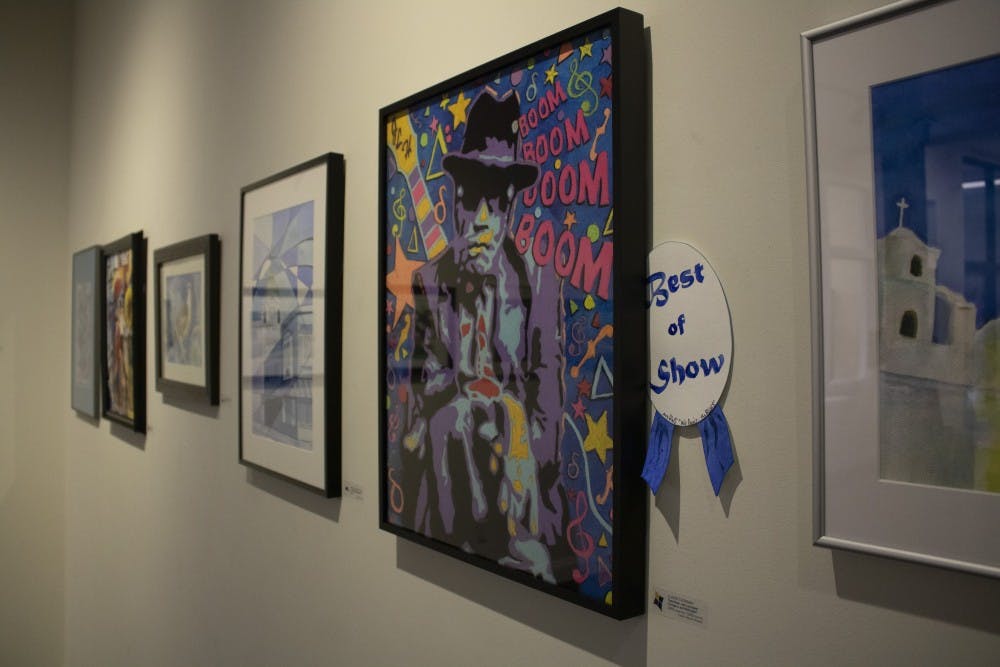 <p>Art exhibit “We Paint… the Blues” showcases local art from Feb. 1 to March 29 at The Vault at Gallery Mortgage in downtown Bloomington. All of the artwork follows the theme of “blues,” so every piece reflects this by either its color, emotion or definition. </p>