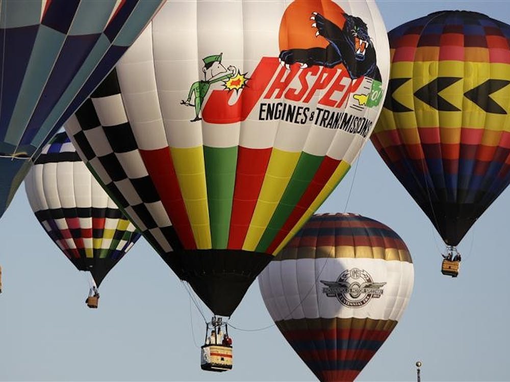 Pilots line-up their hot air balloons as they prepare to drop their competition marker during the Founders Race at the Centennial Era Balloon Festival in Indianapolis, Sunday, May 9, 2010.  (AP Photo/Darron Cummings)