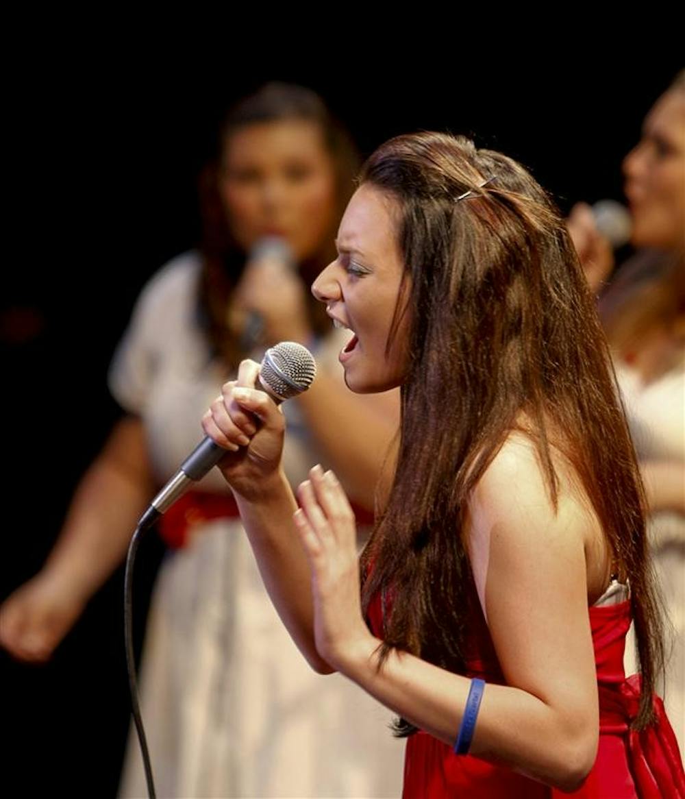 Freshman Rachel Cerrone sings during the Ladies First Spring Concert Saturday evening at the IU Auditorium. Beginning as a class project by Ladies First member Jess Haney, the concert was held as a benefit for Carlos Vidaurri, who suffers from bone cancer.