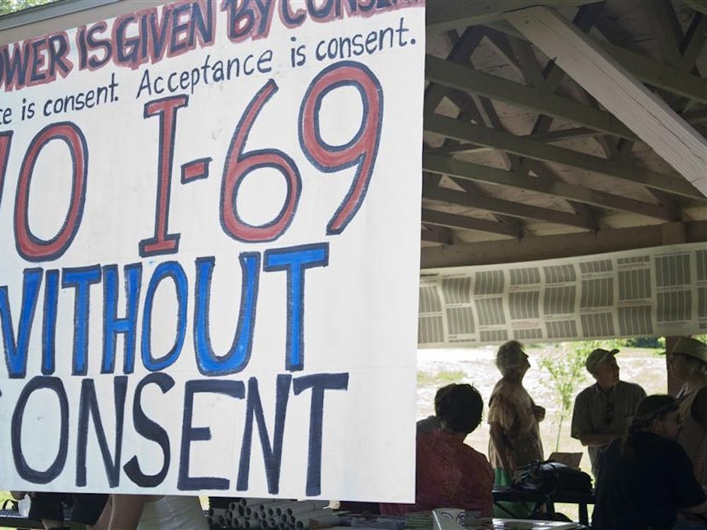 A banner hangs at the Anti-I-69 Community Picnic at Reverend Ernest D. Butler Park on Sunday. 