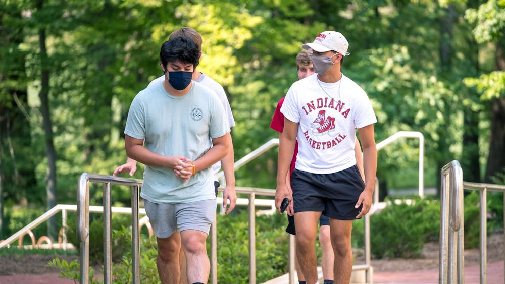 Freshman students walk through campusAug. 24. The group wore their masks for the duration of their journey, which ended at the Indiana Avenue Starbucks.