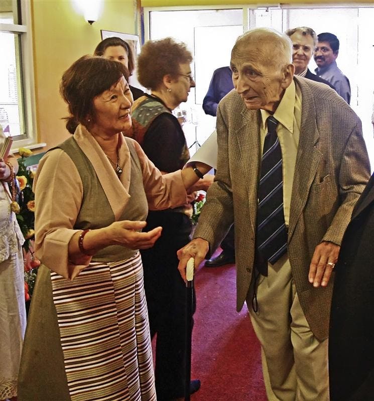 Kunyang Norbu greats IU Professor Emeritus Denis Sinor Wednesday afternoon at the Tibetan Cultural Center. Norbu is the widow of Thubten Norbu, brother of the Dalai Lama, while Sinor brought Thubten Norbu to IU, offering him a job.