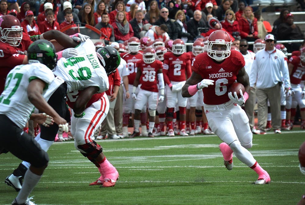 Junior running back Tevin Coleman runs with the ball during IU's game against North Texas on Saturday at Memorial Stadium.