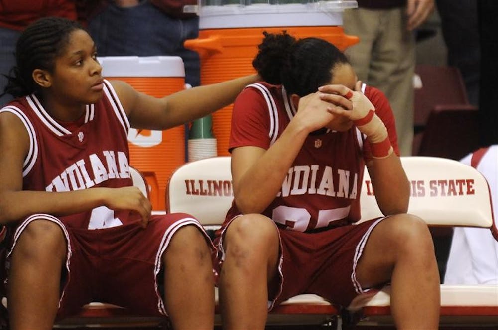 IU senior guard Kim Roberson, right, puts her head in her hands after fouling out of a Women's NIT game against Illinois State on Sunday in Normal, Ill. Roberson ended her IU career with 14 points and three rebounds after IU lost 66-55.