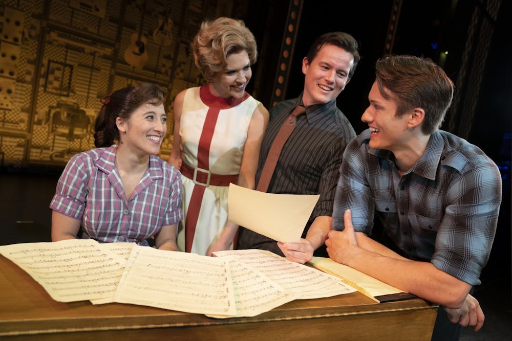<p>Actor Ryan Farnsworth holds a paper with fellow cast members Sara Shepard, Sara King and James D. Gish in Carole King&#x27;s musical &quot;Beautiful.&quot; “Beautiful” will run at 8 p.m. Dec. 10 and 11 and 2 p.m. on Dec. 11 and 12 at the IU Auditorium. </p>