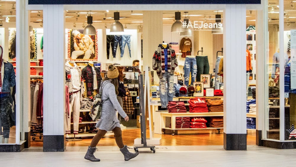 A person walks in front of American Eagle Outfitters on Nov. 14, 2021, at the College Mall on East Third Street.