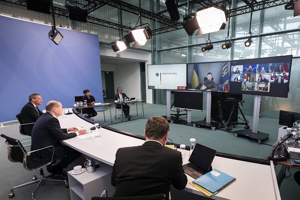 In this handout image provided by German Government Press Office, German Chancellor Olaf Scholz takes part in a video conference with Ukrainian President Volodymyr Zelenskyy and the head of states of G7 on Oct. 11, 2022, in Berlin, Germany.