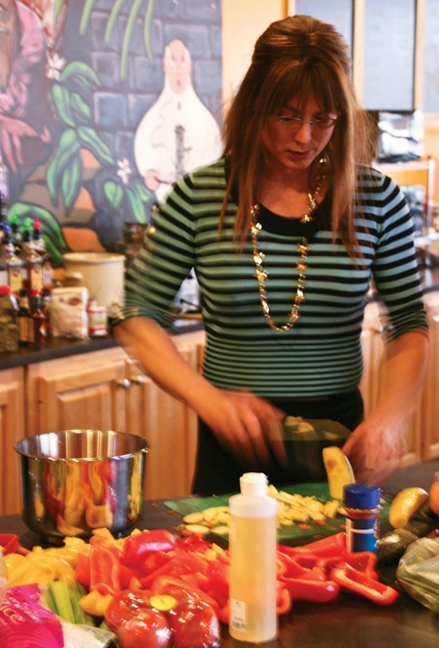Rachael’s Cafe owner and founder Rachael Jones prepares vegetables Tuesday, Feb. 5, for the cafe’s Fat Tuesday celebration.