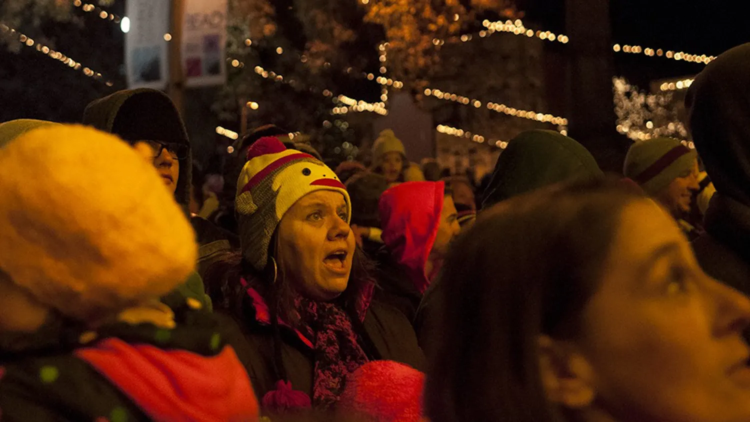 People sing along to christmas carols during the annual Canopy of Lights event Nov. 29, 2013, in front of the Monroe County Courthouse.