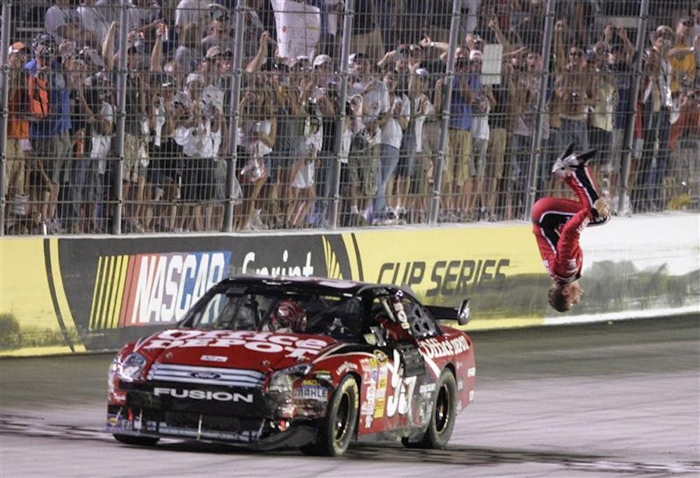 Carl Edwards does his trademark back flip after winning the NASCAR Sprint Cup Series Sharpie 500 auto race Saturday night at the Bristol Motor Speedway in Bristol Tenn.