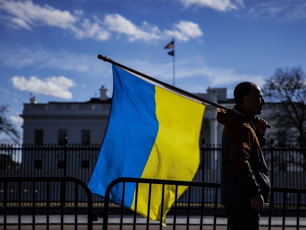 A man holding a Ukrainian flag is pictured on Feb. 25, 2022, in Washington, DC. More than 12 million Ukrainians are believed to have fled their homes since the conflict with Russia escalated Feb. 24.