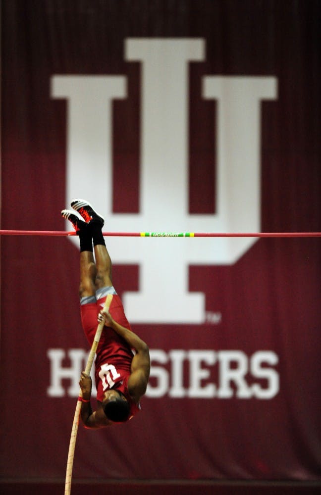 Junior Terry Batemon pole vaults during an event at Gladstein Fieldhouse.
