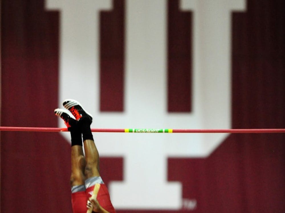 Junior Terry Batemon pole vaults during an event at Gladstein Fieldhouse.