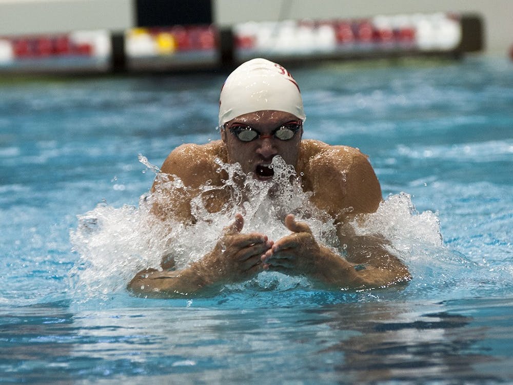 Then-senior Cody Miller swims in the 200 yard breaststroke during the meet against University of Kentucky and University of Tennessee on November 1, 2013, at the Counsilman-Billingsley Aquatic Center. 