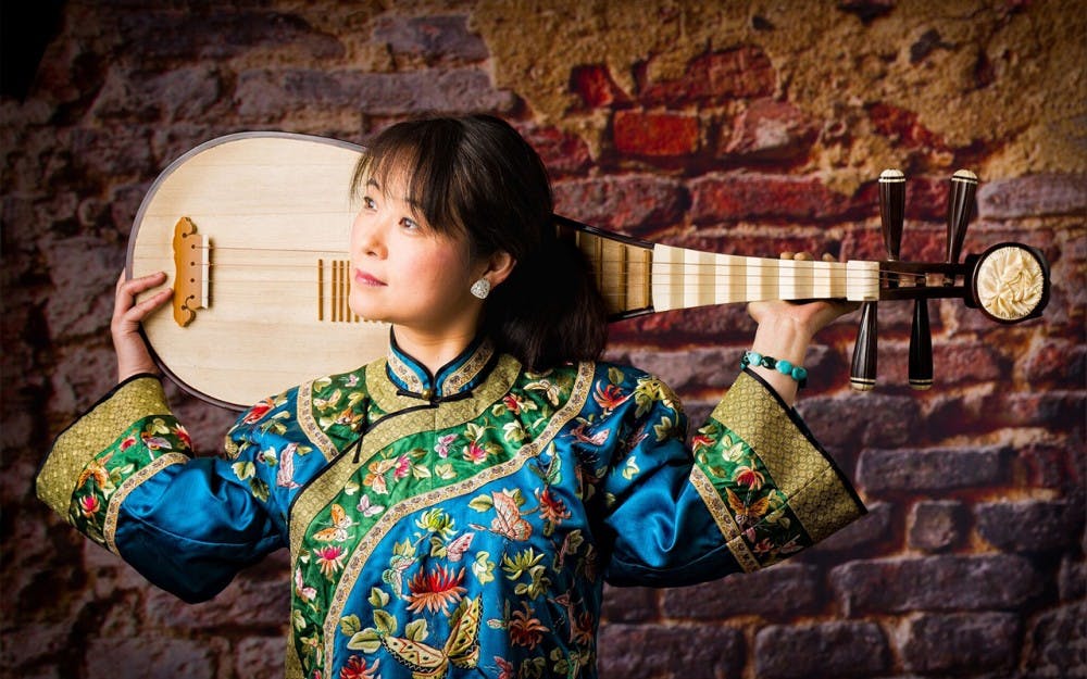Grammy Award-winning musician Wu Man holds her pipa. Students from the Jacob's School of Music will perform with her March 31.