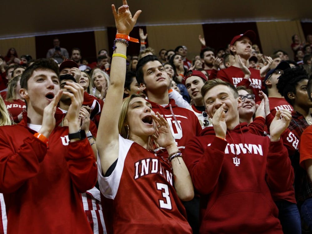 Students cheer on the IU basketball team arriving on the court March 23 at Simon Skjodt Assembly Hall. Butler University&#x27;s Joey Brunk is transferring to IU. 
