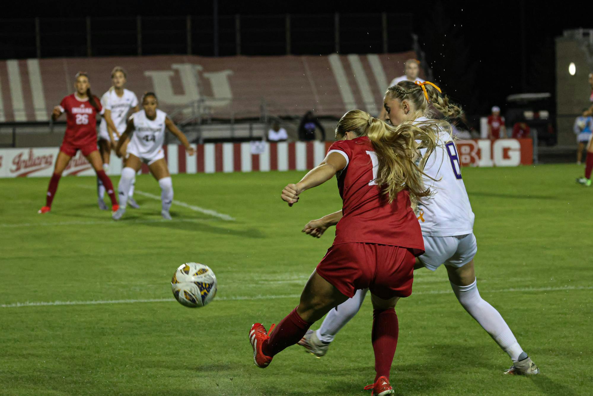 Senior forward Marisa Grzesiak kicks the ball towards the goal against Washington on Sept. 25, 2025, at Bill Armstrong Stadium in Bloomington. The Hoosiers and Huskies tied 0-0.