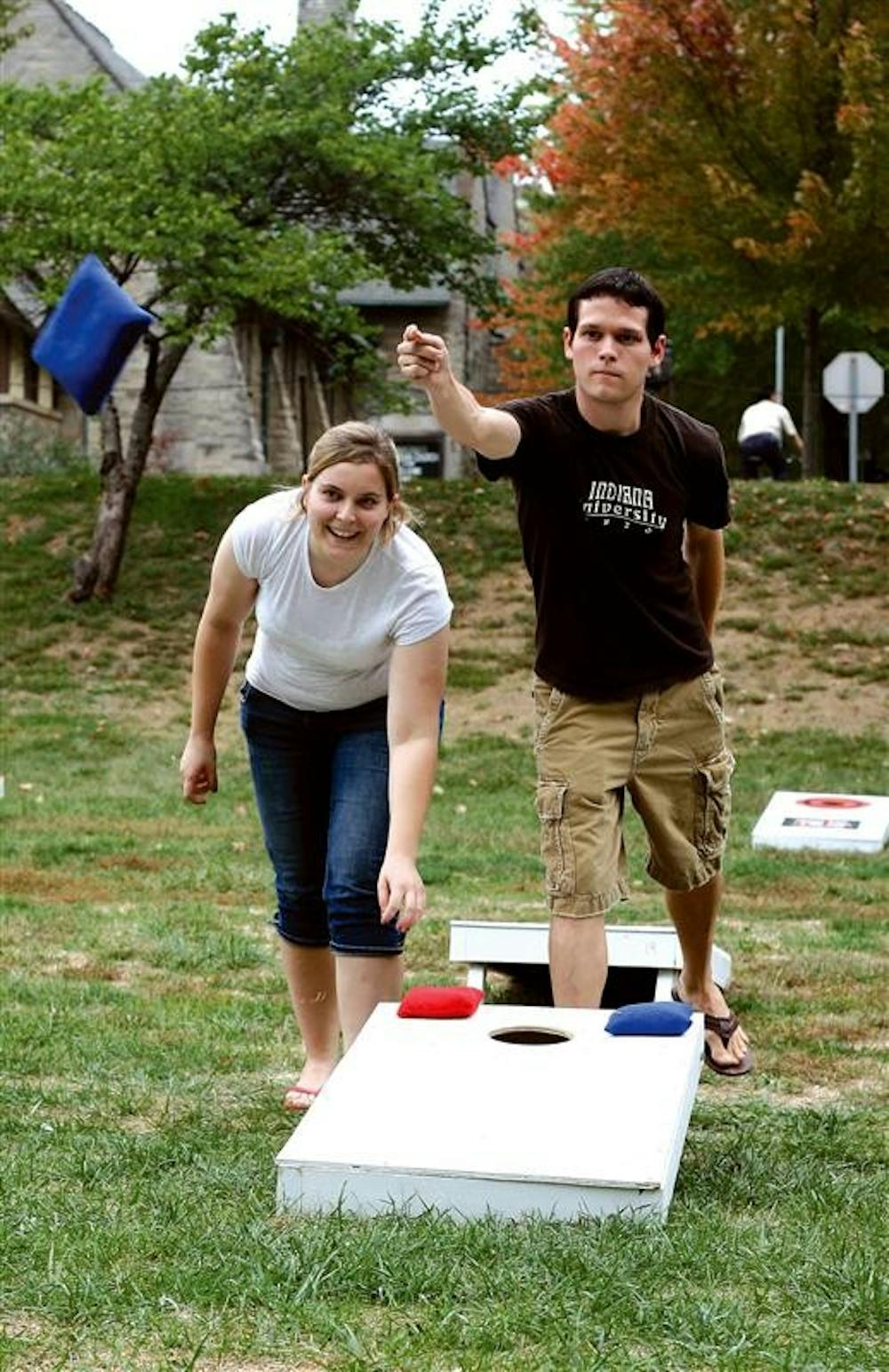 Sophomores Jeremy Crowe and Noreen Posge compete during the first round of cornhole games during the World's Largest Cornhole Tournament on Oct. 17, 2007 in Dunn Meadow. The event included catered foot and live music.