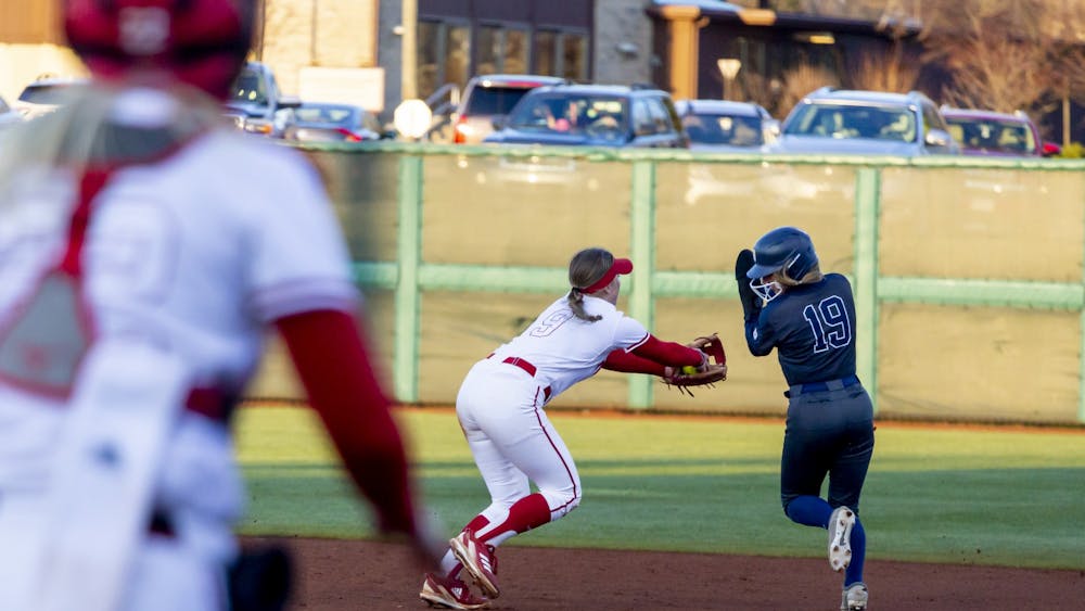Freshman Taryn Kern attempts to tag out a runner March 28, 2023, at Andy Mohr Field. The win against Butler marks the Hoosiers&#x27; sixteenth straight win.