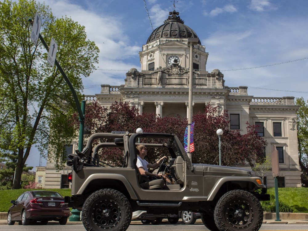 A car drives April 22, 2019, past the Monroe County Courthouse. Jennifer Schepers, director of the Paul H. O’Neill School of Public and Environmental Affairs Career Hub, said students in the school are supposed to have 120 hours of internship credit through the school in order to graduate.