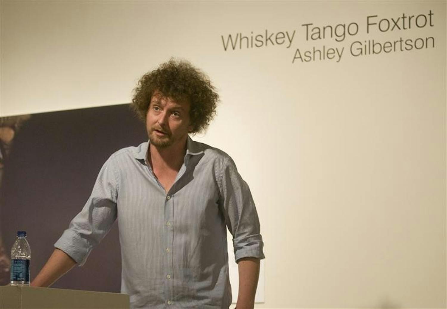 Photographer Ashley Gilbertson speaks about his book "Whiskey Tango Foxtrot," which chronicles his experiences covering the Iraq War, Tuesday evening at the SOFA gallery. Gilbertson is an awards-winning photojournalist for the New York Times.