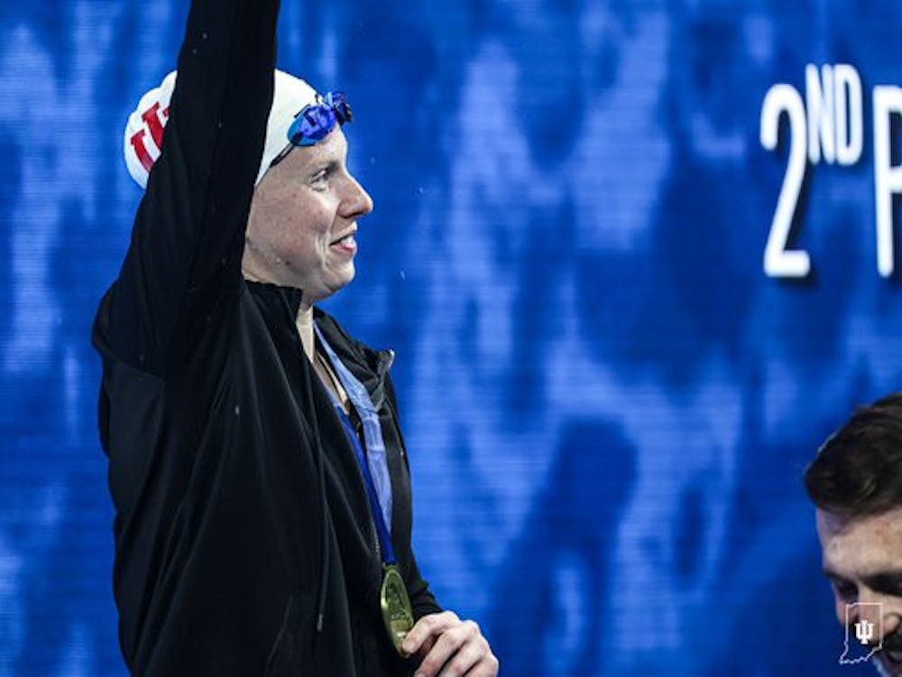 Former Indiana University swimmer Lilly King, part of the Indiana Swim Club, is awarded a medal for winning the women's 50-meter breaststroke event at the Phillips 66 National Championships in Indianapolis on June 29. 