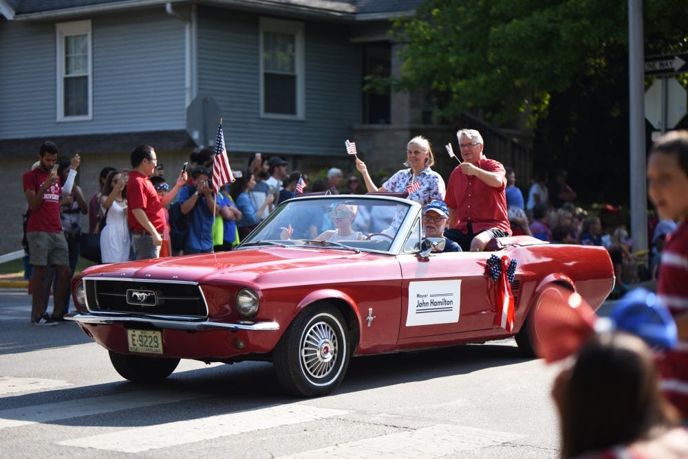 Bloomington’s mayor John Hamilton and his wife start the 4th of July parade on Tuesday. The parade attracted hundreds of visitors to sit and watch different floats parade downtown.