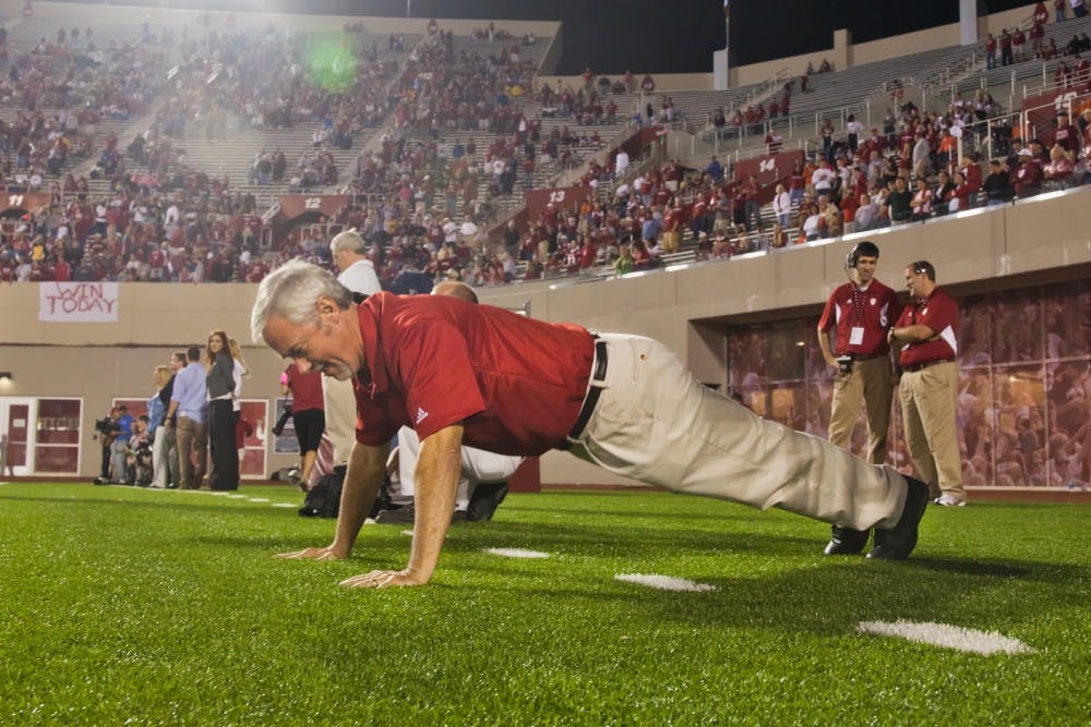 Tom Bush does pushups in the north end zone of Memorial Stadium during an IU football game. Since he started doing push-ups in 2005, he's done 12,291 through the 2016 season.