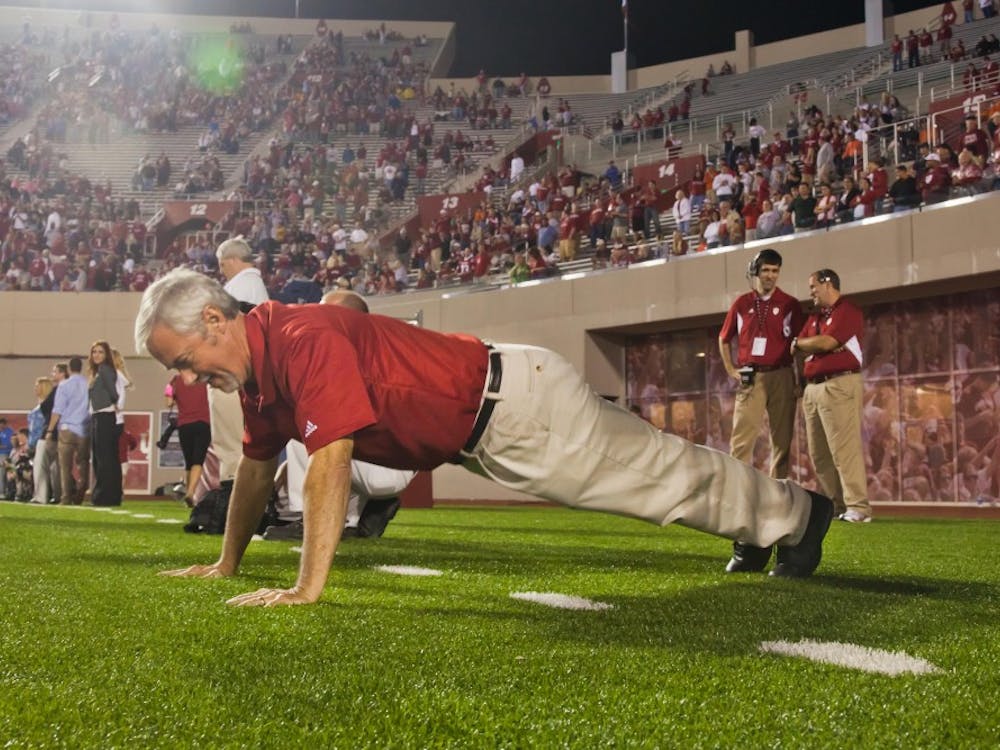 Tom Bush does pushups in the north end zone of Memorial Stadium during an IU football game. Since he started doing push-ups in 2005, he's done 12,291 through the 2016 season.