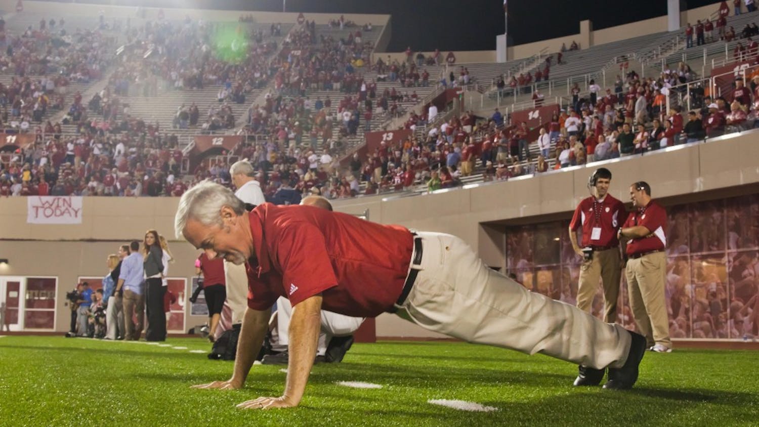 Tom Bush does pushups in the north end zone of Memorial Stadium during an IU football game. Since he started doing push-ups in 2005, he's done 12,291 through the 2016 season.