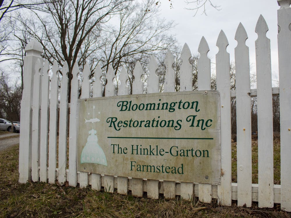 A sign for the Hinkle-Garton Farmstead hangs on a fence March 9, 2020, on Tenth Street. The Indiana Maple Syrup Association will conduct its annual Indiana Maple Syrup Weekend at the Hinkle-Garton Farmstead on March 12.