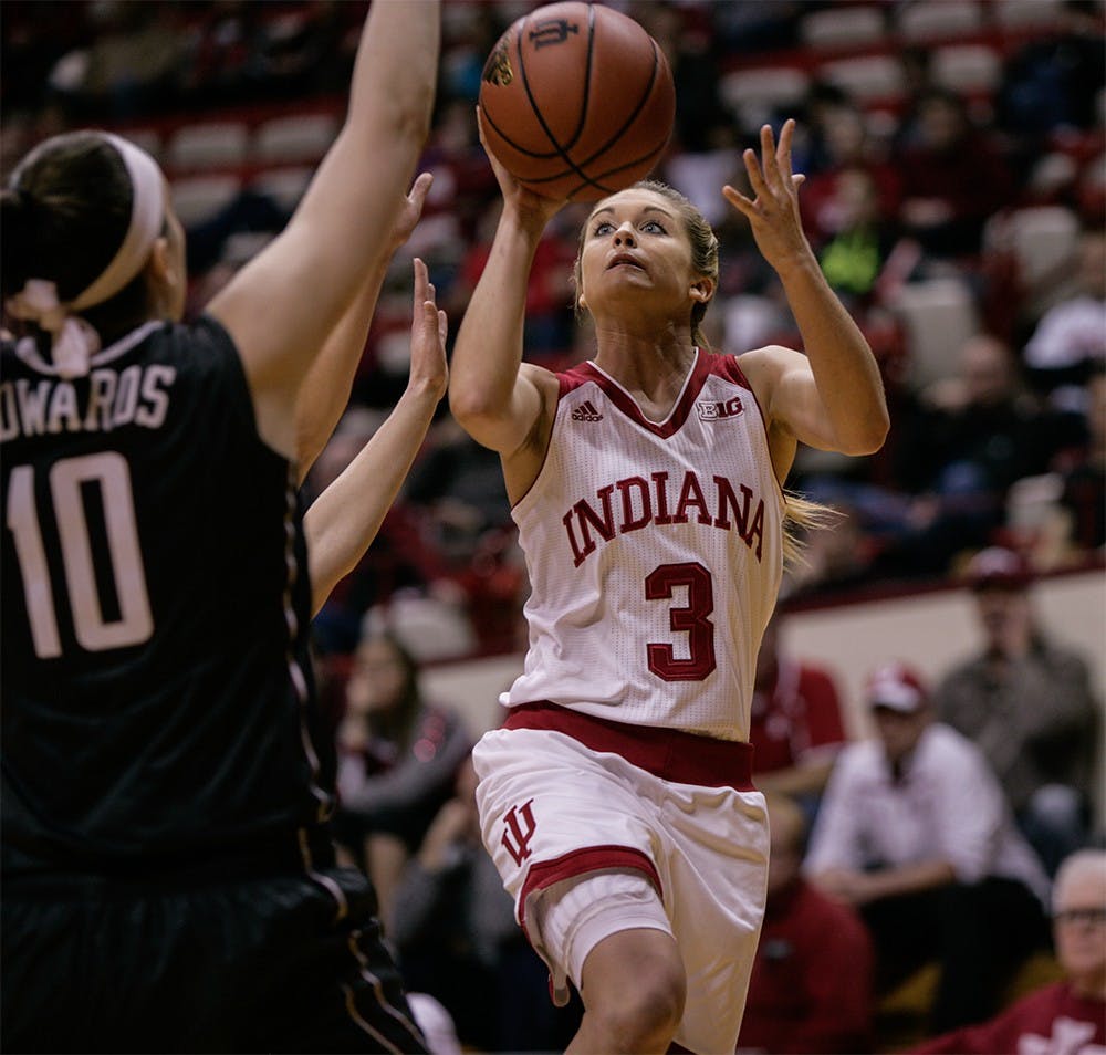 Sophomore guard Tyra Buss goes up to the basket to attempt a layup. Buss led in scoring with 27 points against Minnesota. The Hoosiers beat Minnesota 93-79 Thursday at Assembly Hall.