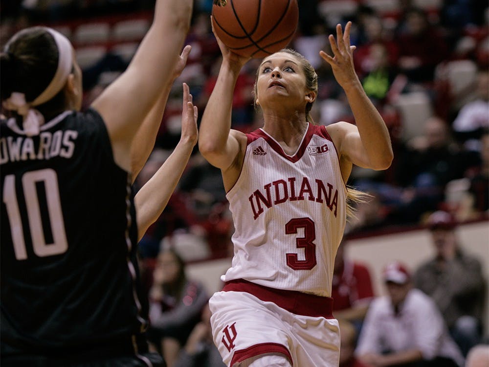 Sophomore guard Tyra Buss goes up to the basket to attempt a layup. Buss led in scoring with 27 points against Minnesota. The Hoosiers beat Minnesota 93-79 Thursday at Assembly Hall.