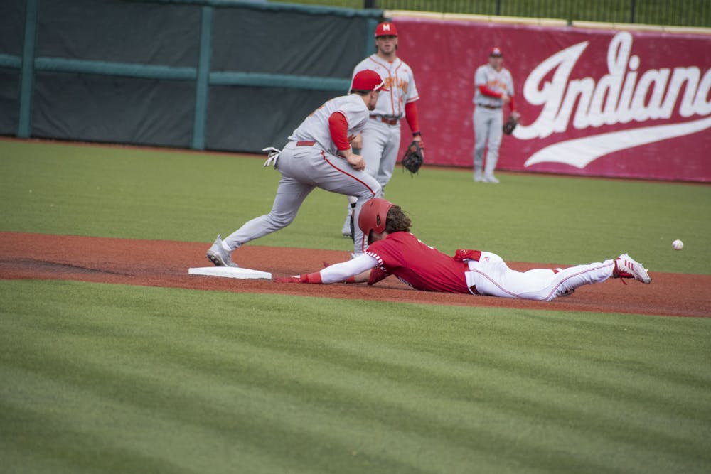 <p>Sophomore designated hitter Carter Mathison slides to second April 30, 2023, against Maryland at Bart Kaufman Field in Bloomington.</p>
