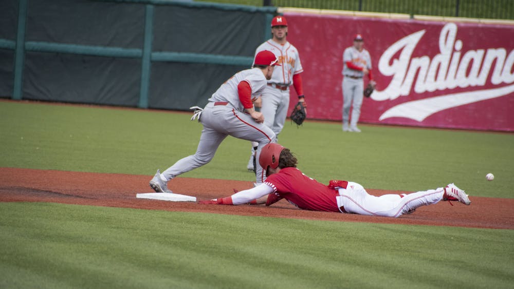 Sophomore designated hitter Carter Mathison slides to second April 30, 2023, against Maryland at Bart Kaufman Field in Bloomington.