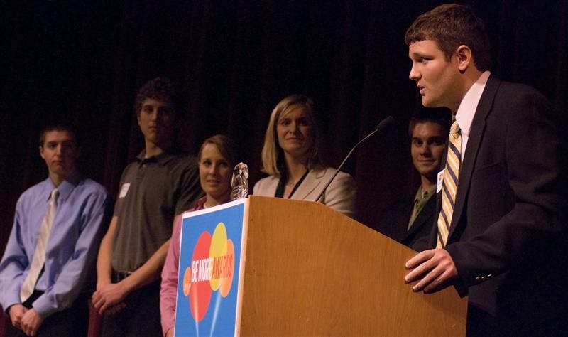 Senior Nick Mattingly, right, accepts the Be More Involved award on behalf of the Kelley School of Business Civic Leadership Development program during the Be More Awards on Tuesday evening at the Buskirk-Chumley Theater. Joining Mattingly were other members of the program, including freshman Nick Innocenti, sophomore John Gjeldum, junior Brittany Nelson, faculty director Molly Barwick and junior Dan Quinn.