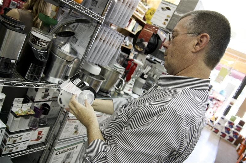 Rob Turner looks at orange juicers Saturday morning at Good for Cooks. 