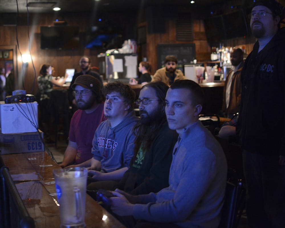 Patrick Donaldson, Ivy Tech student and Bloomington resident, competes with players from other groups during a video game tournament at Bear's Place. He said he comes to play for the "glory of winning."  