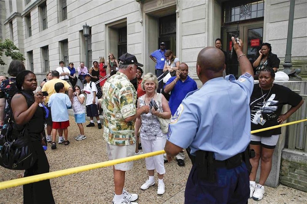 Police barricade museum visitors outside the U.S. Holocaust Memorial Museum in Washington, Wednesday, June 10, 2009. Authorities say at least two people have been shot at the museum. 