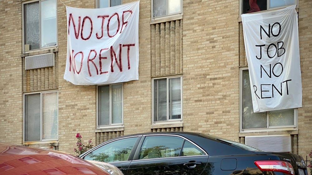 Banners against renters eviction reading "no job, no rent" are displayed on a controlled rent building Aug. 9 in Washington, D.C.