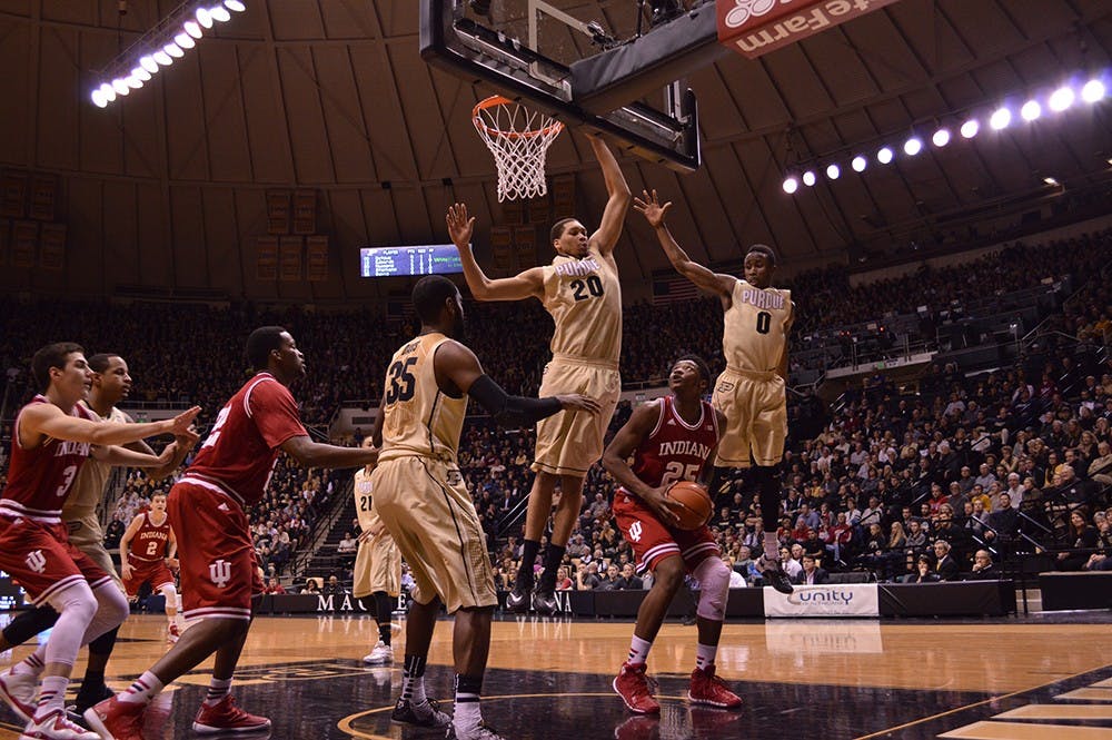 Freshman Emmitt Holt prepares to shoot as Purdue junior center A.J. Hammons and senior guard Jon Octeus attempt to block Holt's shot Wednesday night at Mackey Arena.