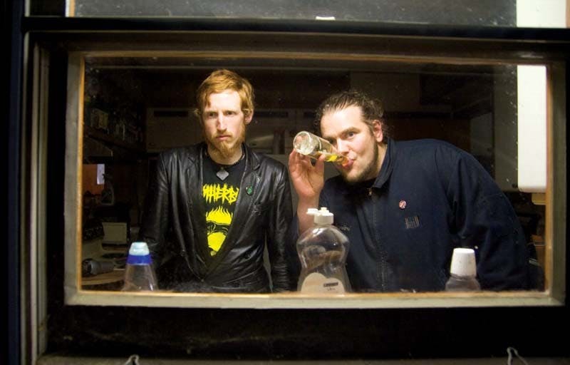 Grand Buffet (Jackson O'Connel-Barlow and Jarrod Weeks) prepare mentally and alcoholicly for their concert April 4 in a Bloomington basement.