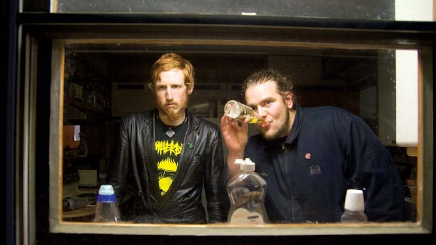 Grand Buffet (Jackson O'Connel-Barlow and Jarrod Weeks) prepare mentally and alcoholicly for their concert April 4 in a Bloomington basement.