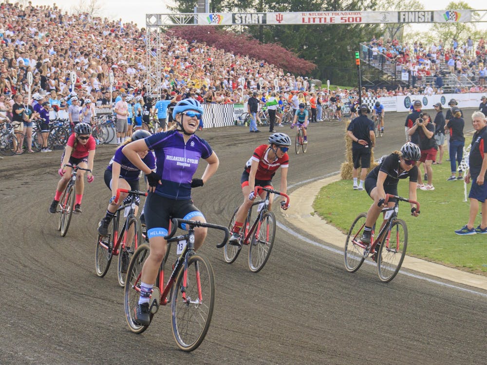 A rider from Melanzana Cycling celebrates her win on April 22, 2022, at Bill Armstrong stadium. Melanzana Cycling finished the race in 1 hour, 14 minutes and 15 seconds.