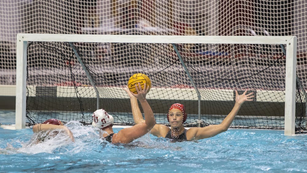 Graduate goalkeeper Mary Askew defends against a shot from Stanford on March 4, 2023, at Counsilman-Billingsley Aquatic Center. IU lost to Stanford 16-7.