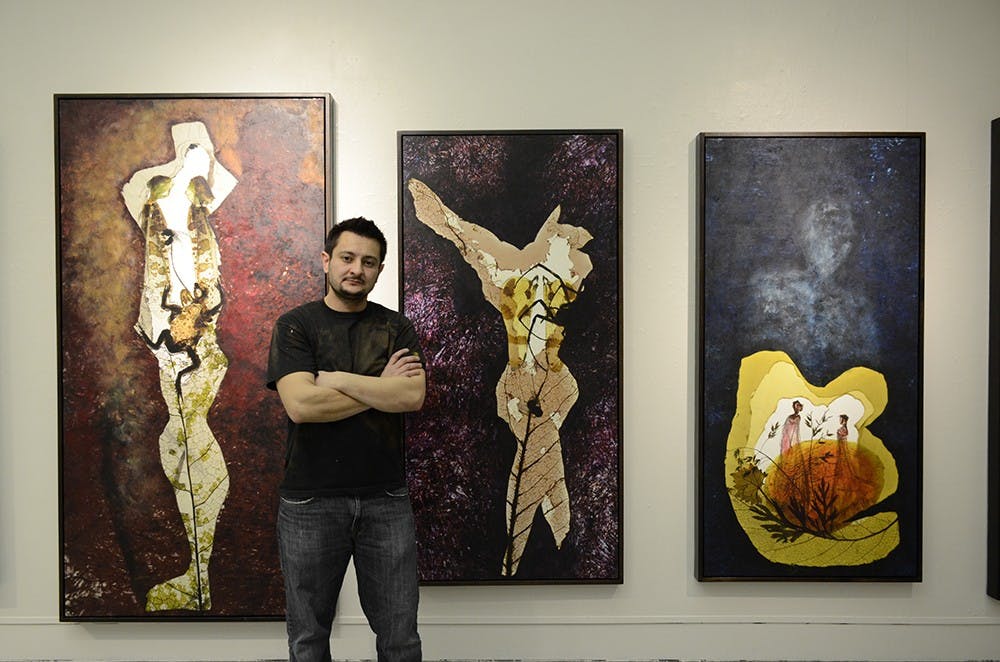 Benjamin Timpson, MFA student in the School of Fine Arts, sets up his "Act Natural" thesis exibition project in the Grunwald Gallery on Tuesday afternoon. The MFA Thesis Exibition will be held from March 25 to April 4 in the Grunwald Gallery. 