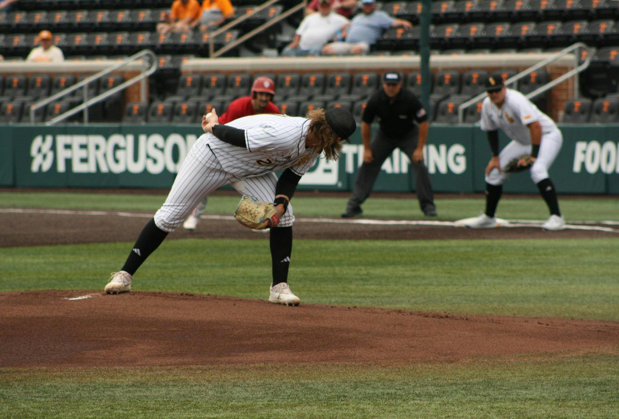 Right-handed pitcher Billy Oldham checks on an Indiana baserunner in the Knoxville Regional on May 31. Oldham allowed 10 hits in 3.2 innings as the Southern Miss starter.