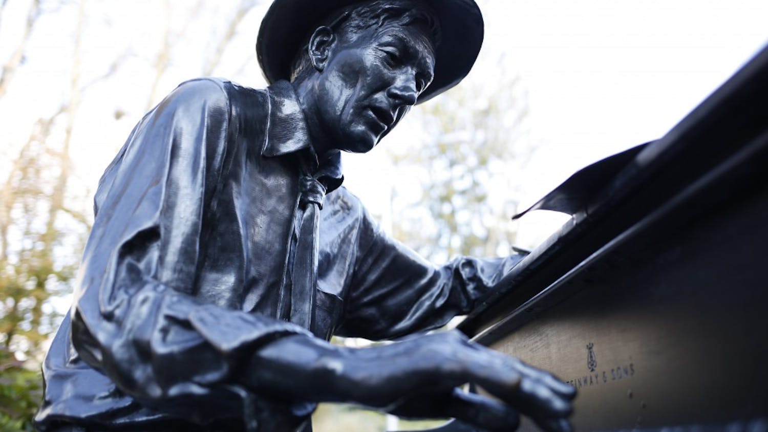 The Hoagy Carmichael statue plays the piano outside of the IU Auditorium. Community radio station WFHB will celebrate Carmichael’s birthday with a fundraising event Nov. 16 at the Fountain Square Ballroom to honor the Bloomington-born musician.&nbsp;